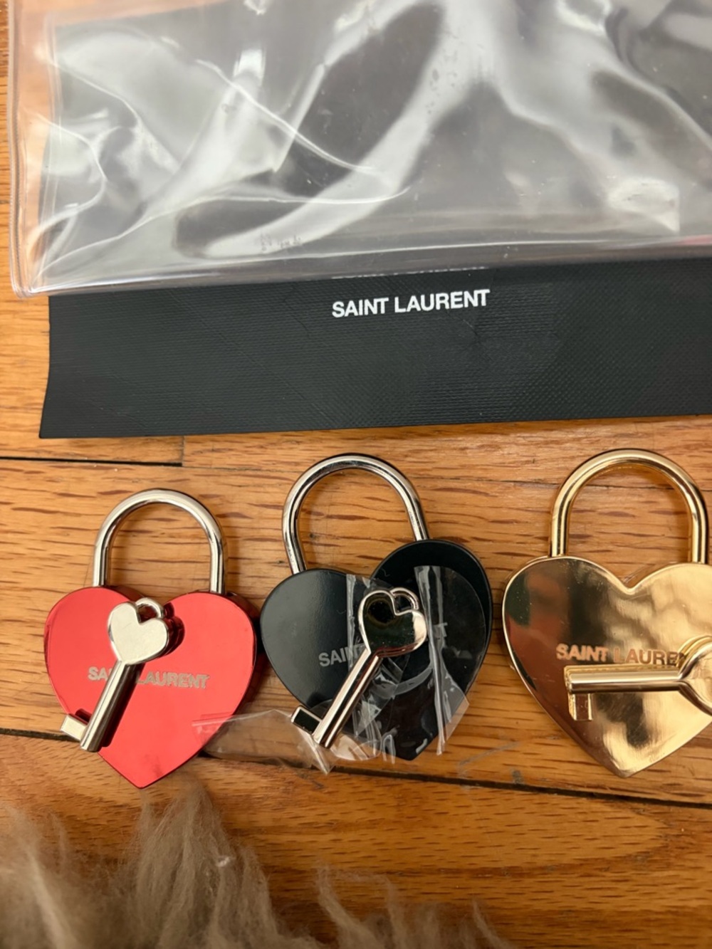 Saint Laurent lock and key . Brand new from Paris .Authentic and never used.